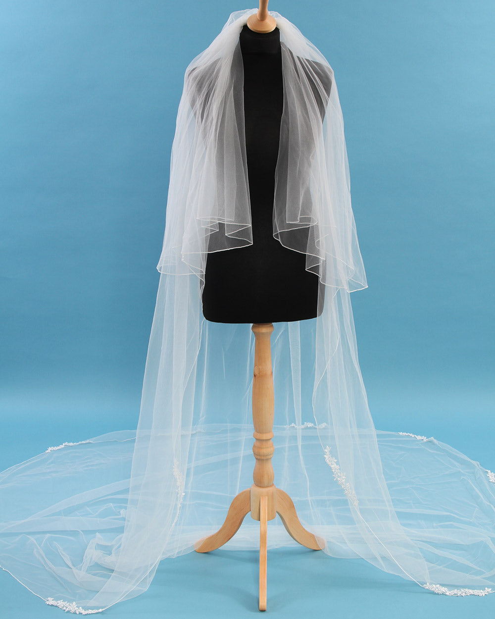 Lend a fabulous floral touch to your bridal look with this beautiful wedding veil. This delicate ivory tulle wedding veil is embellished with a floral lace motif edge.