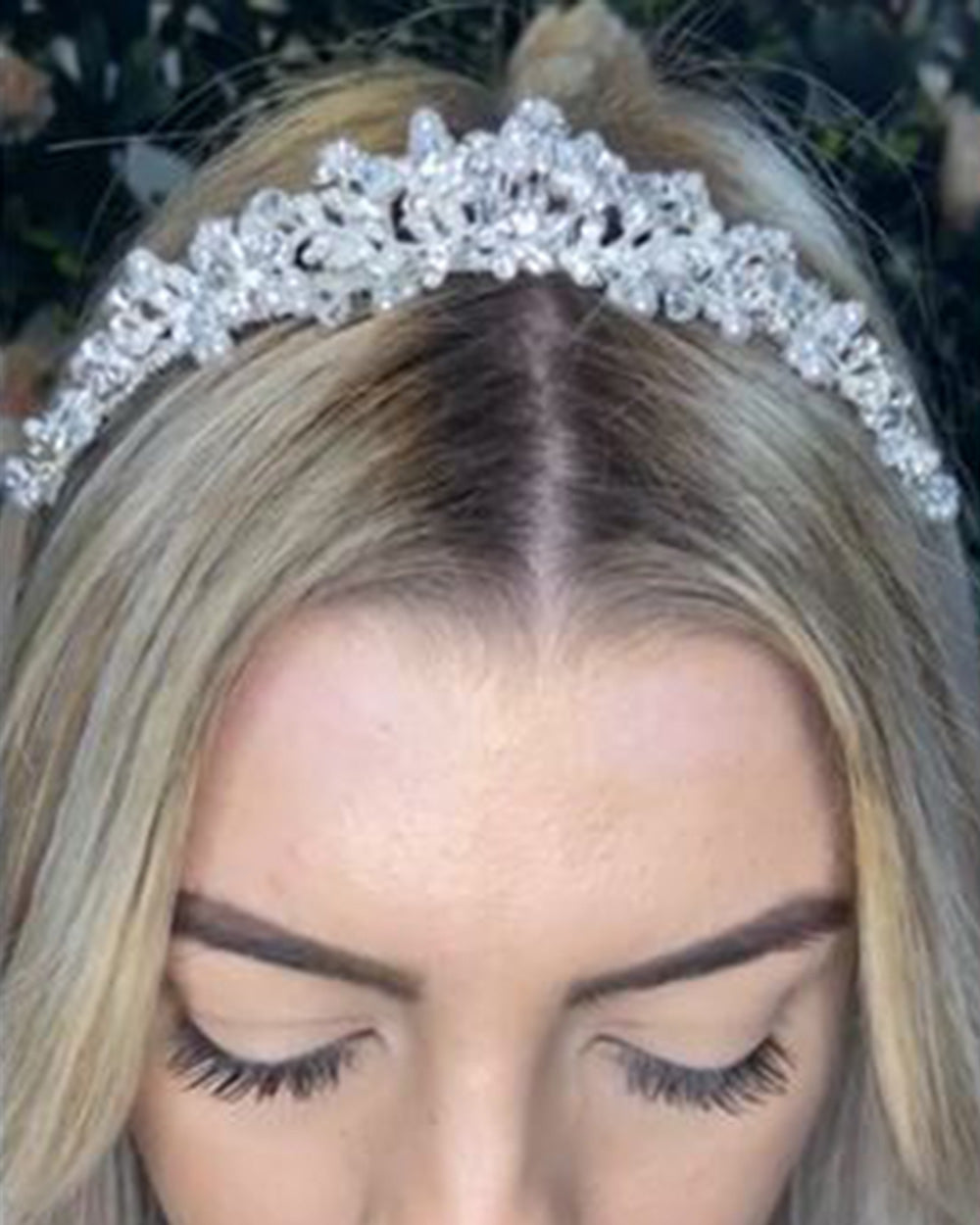 This diamante wedding tiara oozes sophistication and effortless style. Highly detailed with crystals and diamantes to create floral and leaf shapes. Decorated with stunning pearl beads for a classy and timeless design.  Why not take advantage of any and all chances to wear a tiara. If you can't wear one on your wedding day, when can you? Every bride deserves to feel like a true princess on their big day. So, complete your bridal look with one of our beautiful wedding tiaras.