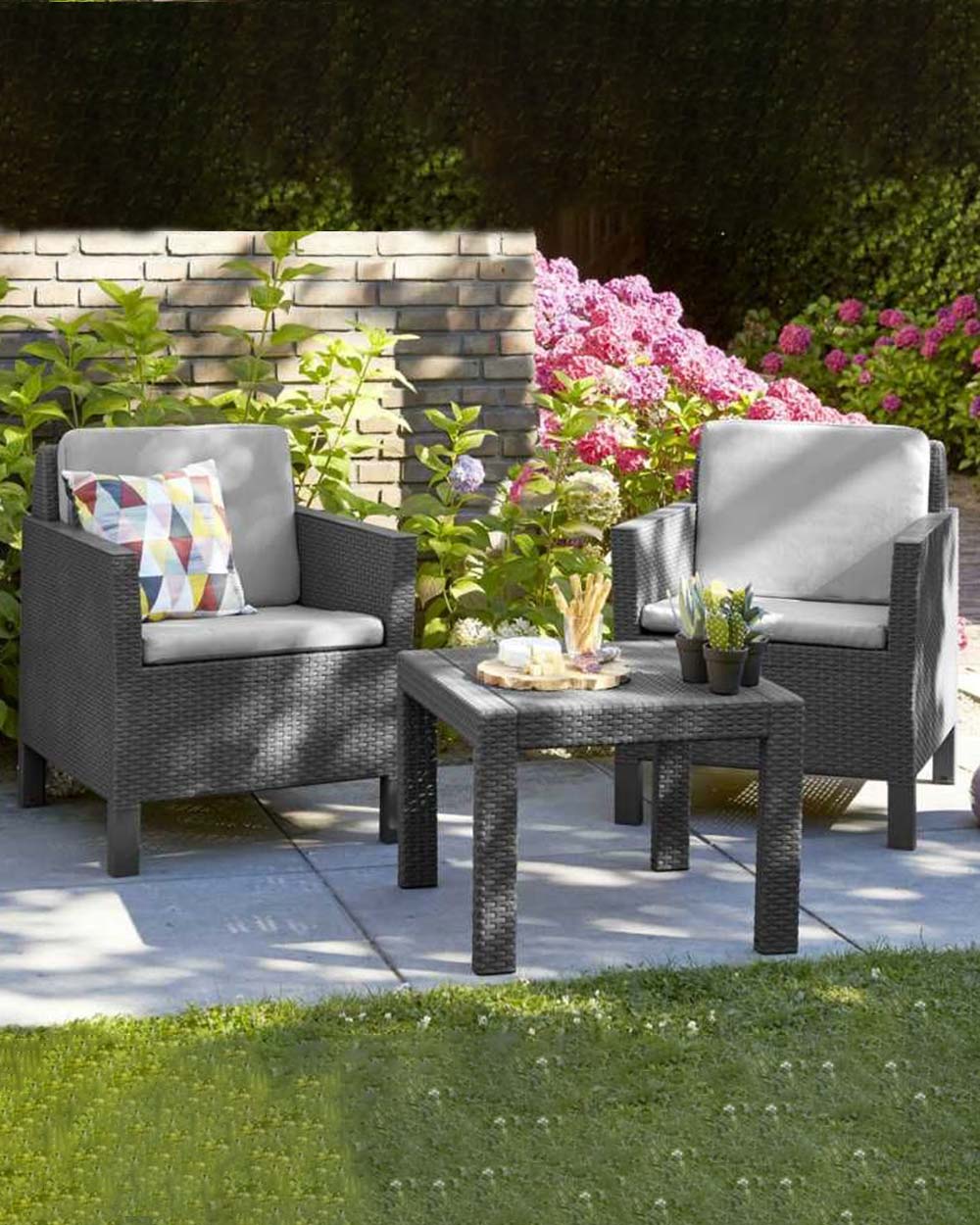 1. Enjoy outdoor relaxation with this stylish rattan bistro set by Keter. Includes table and 2 chairs with cushions, perfect for alfresco dining. 2. Unwind in the sunshine with this modern garden bistro set. Comprising of a table and 2 seats with cushions, it's perfect for any patio or balcony. 3. This hard-wearing bistro set by Keter is perfect for outdoor relaxation. Featuring a table and 2 seats with cushions, it's easy to assemble and low maintenance.