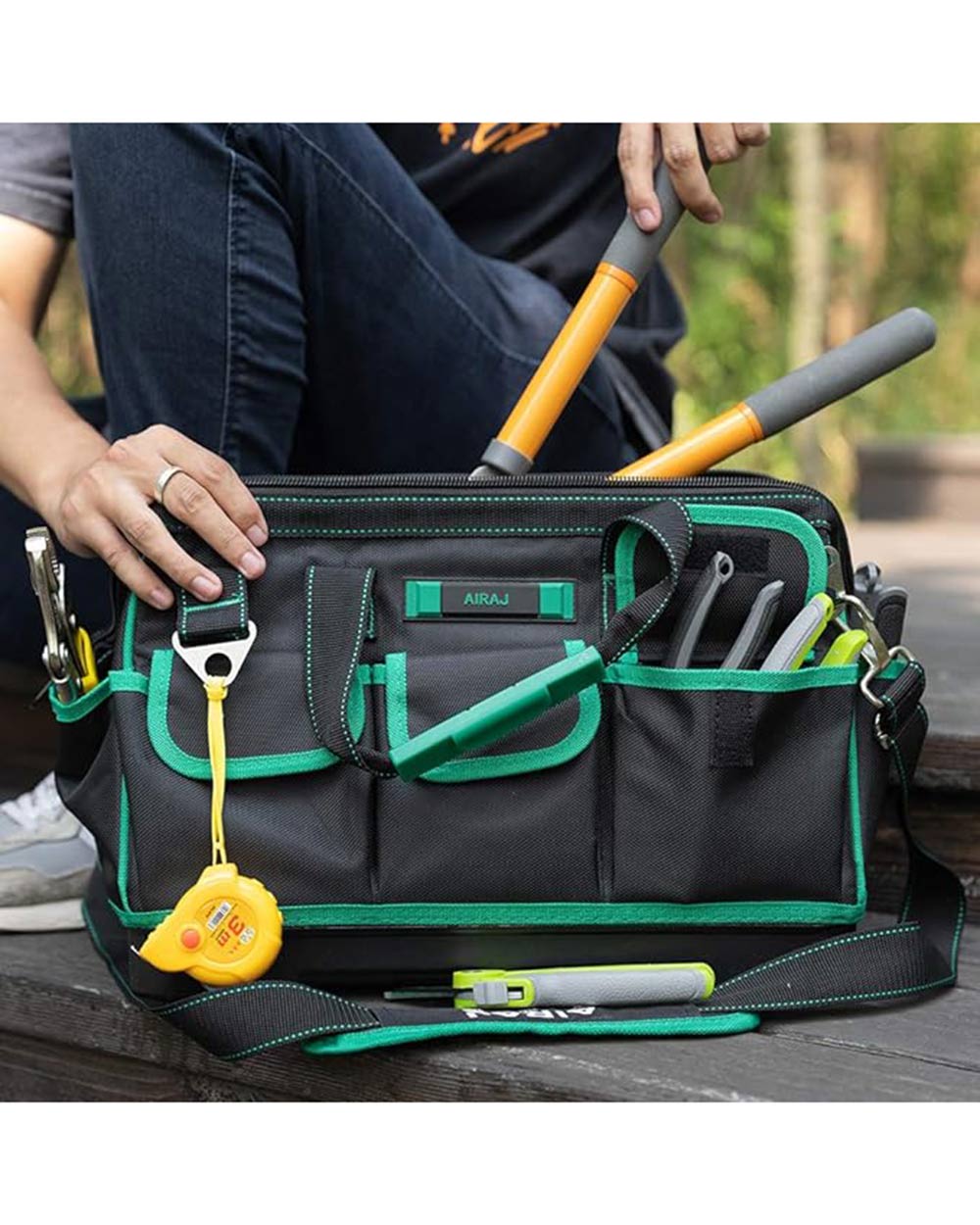 A lifestyle image of a gentleman using this fabric tool bag