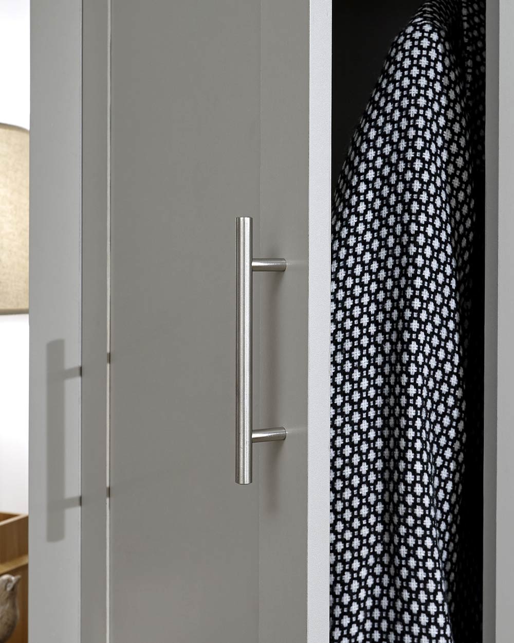Lancaster 2 Door 2 Drawer wardrobe in sleek grey with an oak effect top in a bedroom setting close up of the modern handles