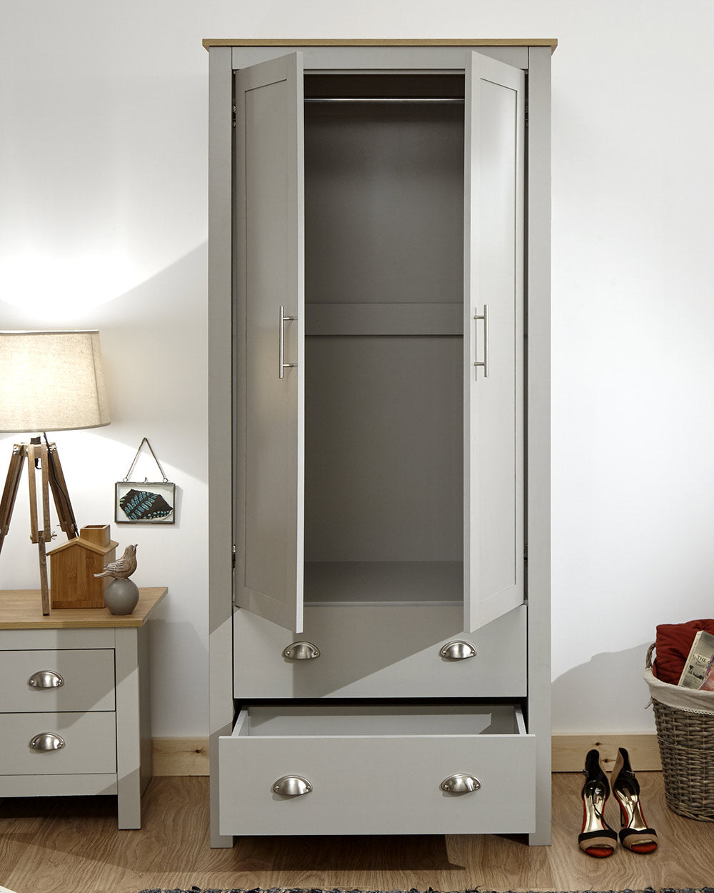Lancaster 2 Door 2 Drawer wardrobe in sleek grey with an oak effect top in a bedroom setting doors open with an empty space 