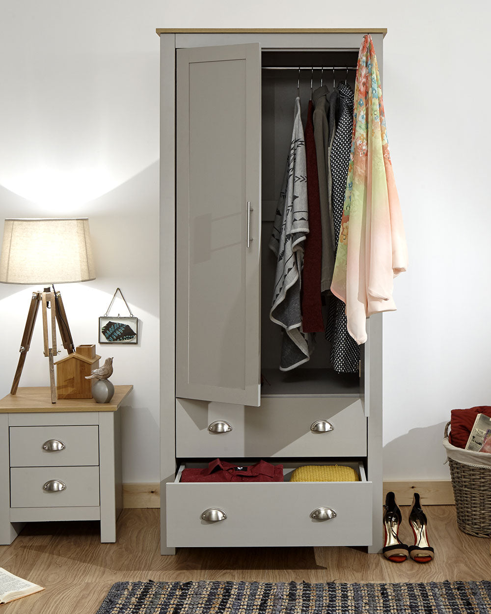 Lancaster 2 Door 2 Drawer wardrobe in sleek grey with an oak effect top in a bedroom setting with the doors ajar