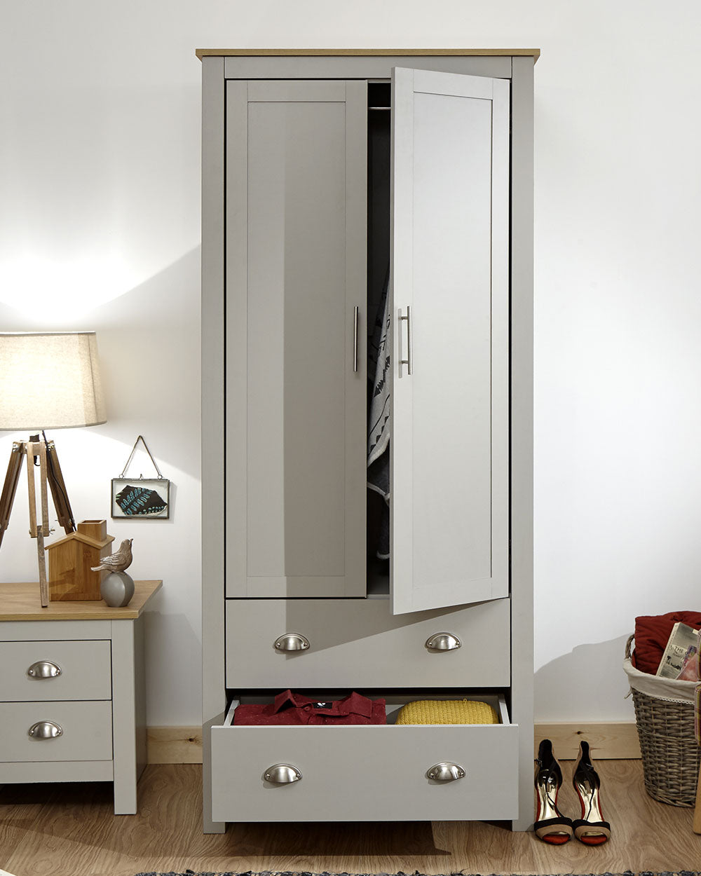 Lancaster 2 Door 2 Drawer wardrobe in sleek grey with an oak effect top in a bedroom setting with the doors open