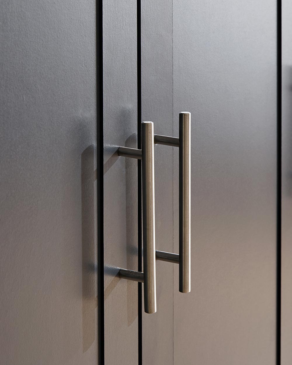 Lancaster4 piece bedroom furniture set by GFW in slate blue in a bedroom setting close up of the wardrobe handles