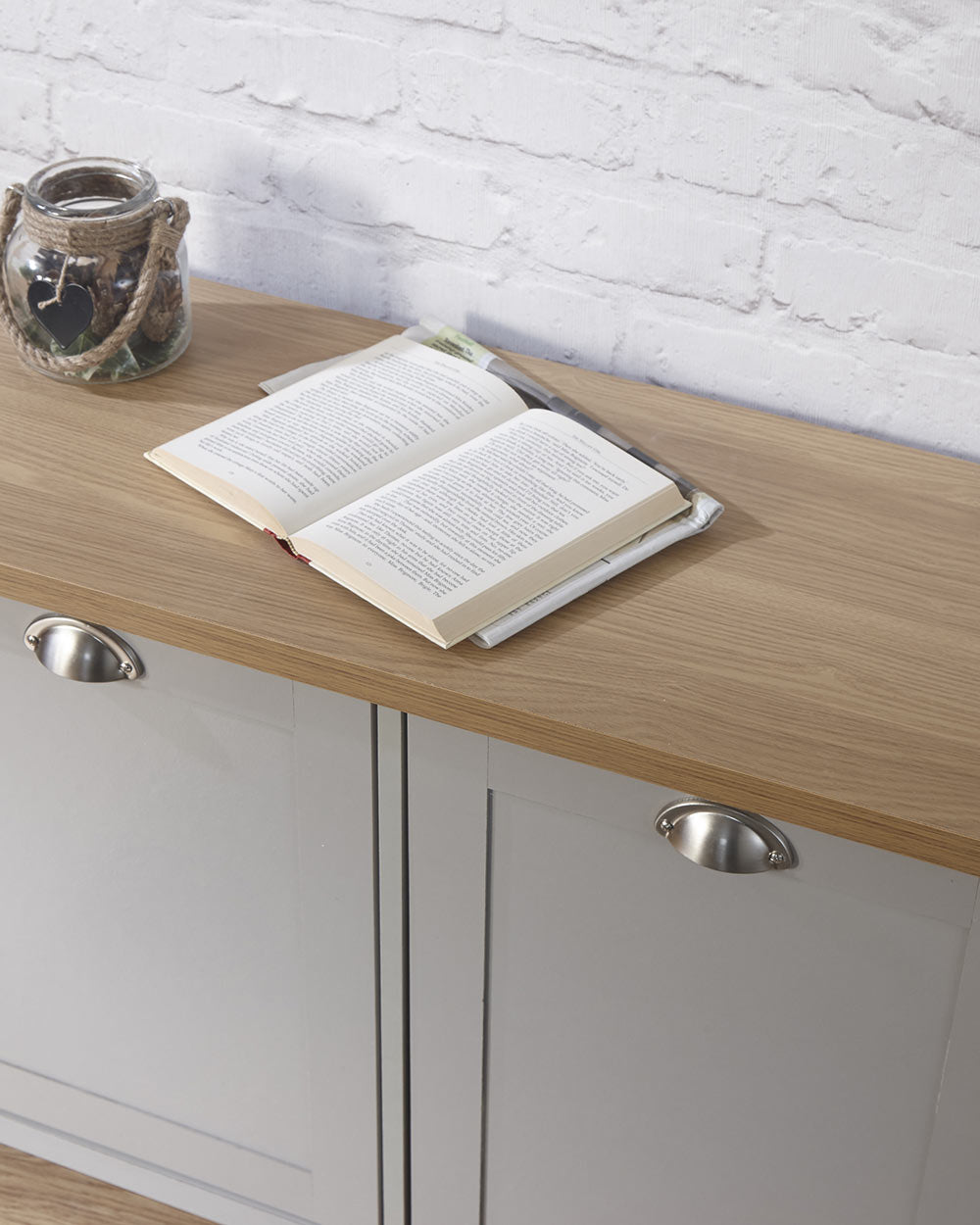 Lancaster shoe storage lifestyle inside a hallway setting. Grey with an oak effect top