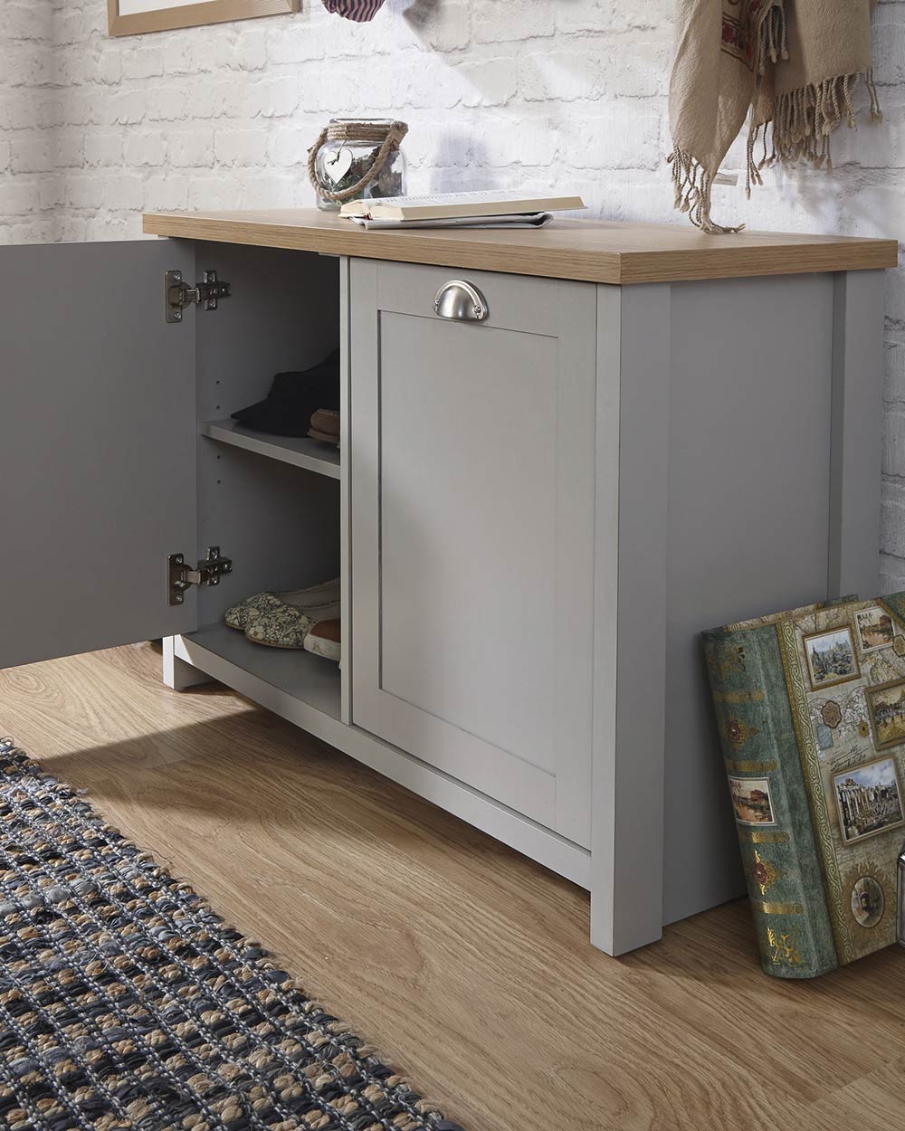Lancaster shoe storage lifestyle inside a hallway setting. Grey with an oak effect top with the door open