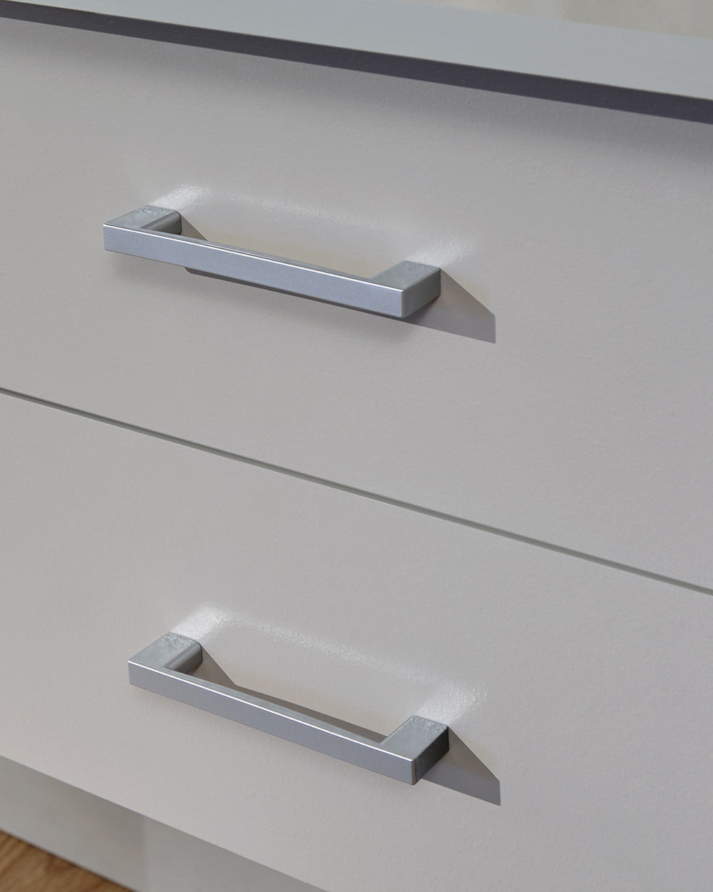 Panama desk in grey in a lifestyle photo in a room close up of the handles