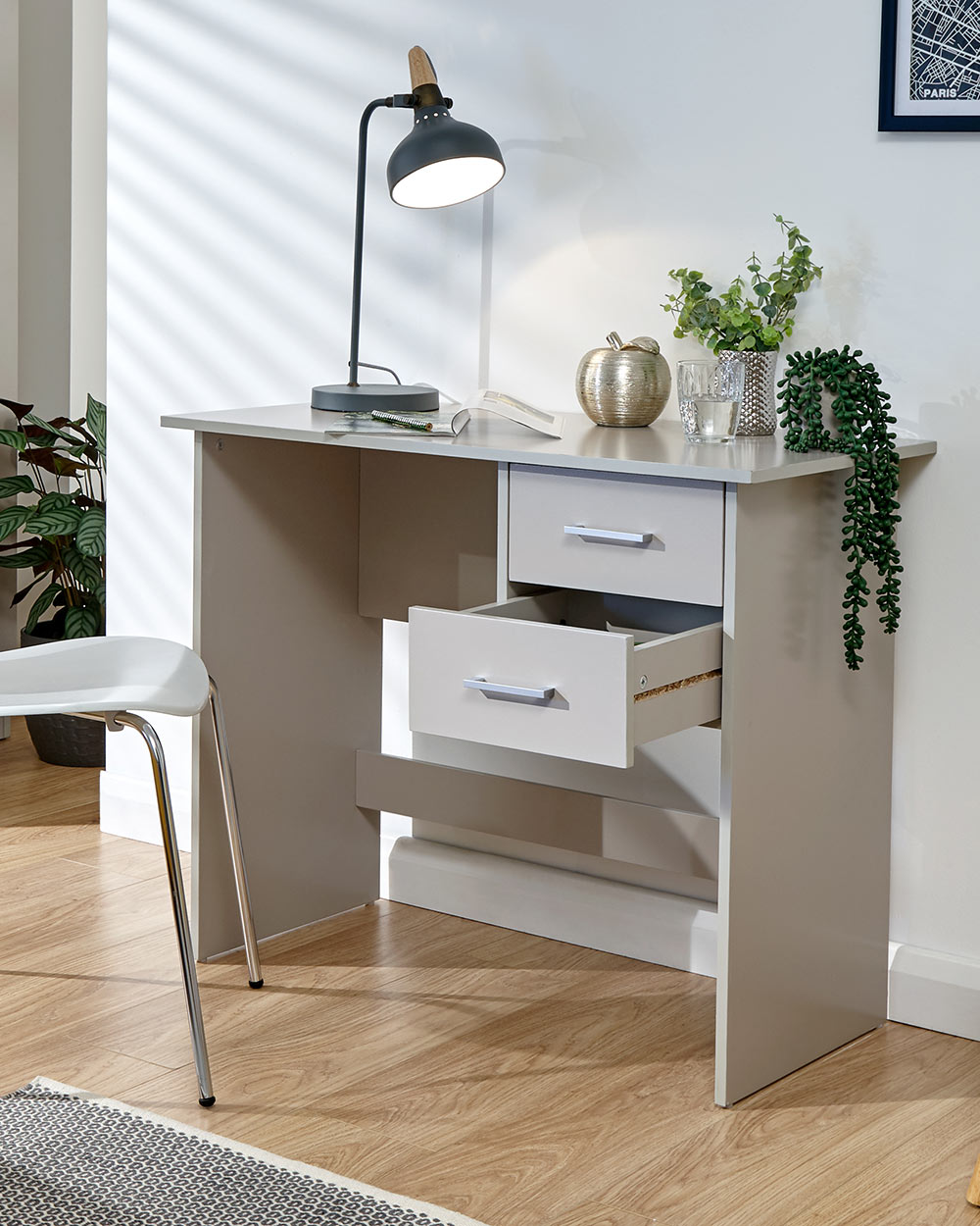 Panama desk in grey in a lifestyle photo in a room with the drawer open