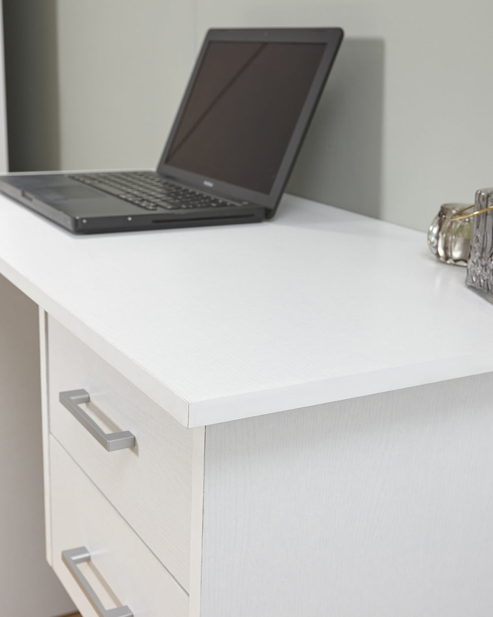 Close up of the white oak effect panels of this panama home office desk