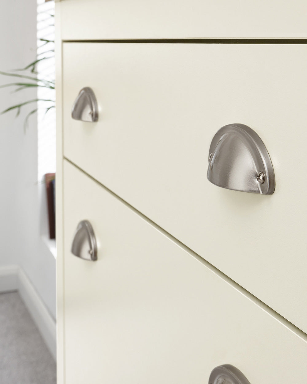 lancaster shoe storage cabinet in cream in  a lifestyle setting close up of the brushed silver handles