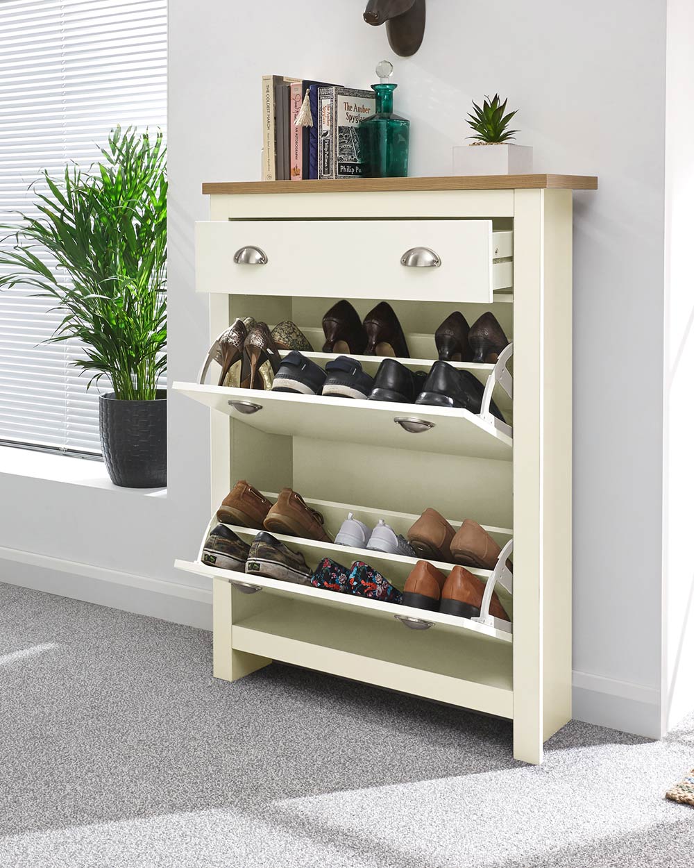 lancaster shoe storage cabinet in cream in  a lifestyle setting with the drop doors down